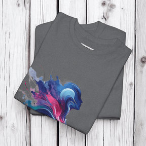 Gray cotton t-shirts with abstract blue and pink splash design folded neatly on a light wooden surface