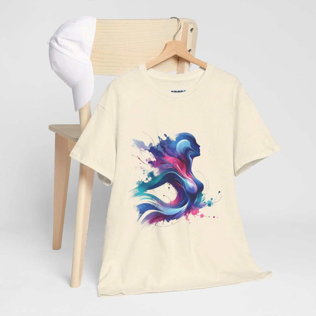 Beige cotton short sleeve shirt featuring an abstract colorful silhouette graphic draped over the back of a chair