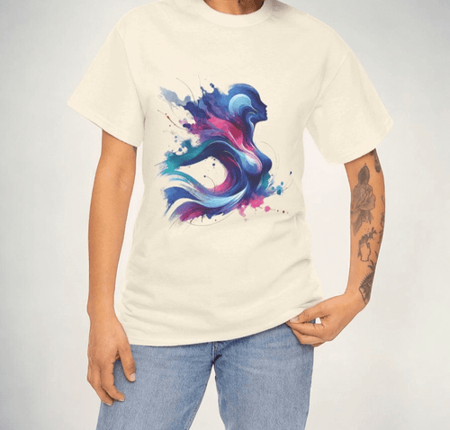 White cotton t-shirt featuring an abstract blue and pink graphic design, worn with jeans by a tattooed person