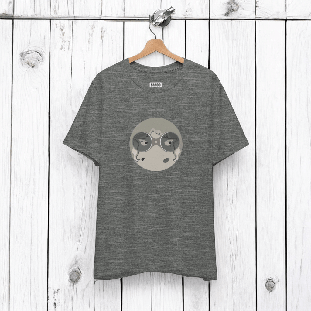 Gray tee with circular graphic of face with closed eyes in gray shades, "SAROO" brand on white wood panel