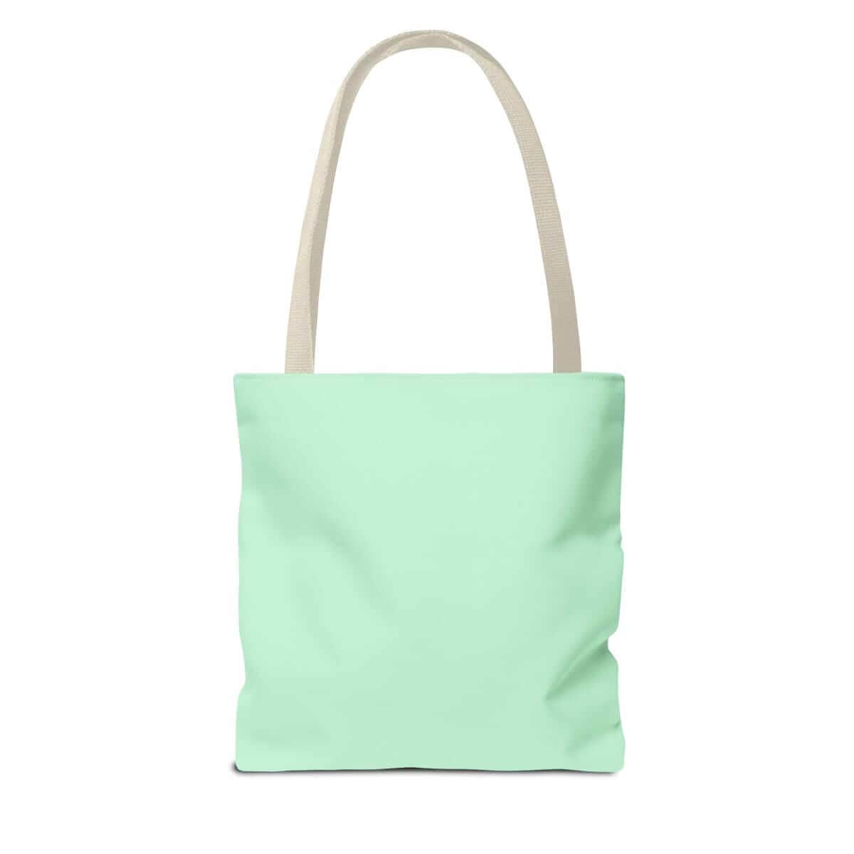 Mint green tote bag with beige canvas handles, minimalist design and structured rectangular body in fabric texture