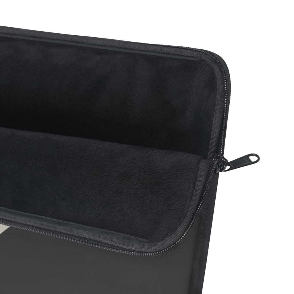 Dark grey zipper laptop sleeve with soft padded fabric interior and minimalist design for device protection
