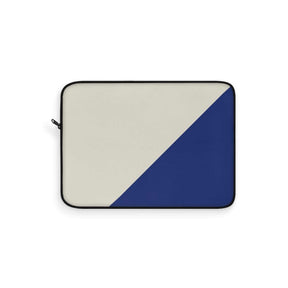 Laptop sleeve with beige and royal blue diagonal color blocks in a minimalist canvas design with visible zipper detail