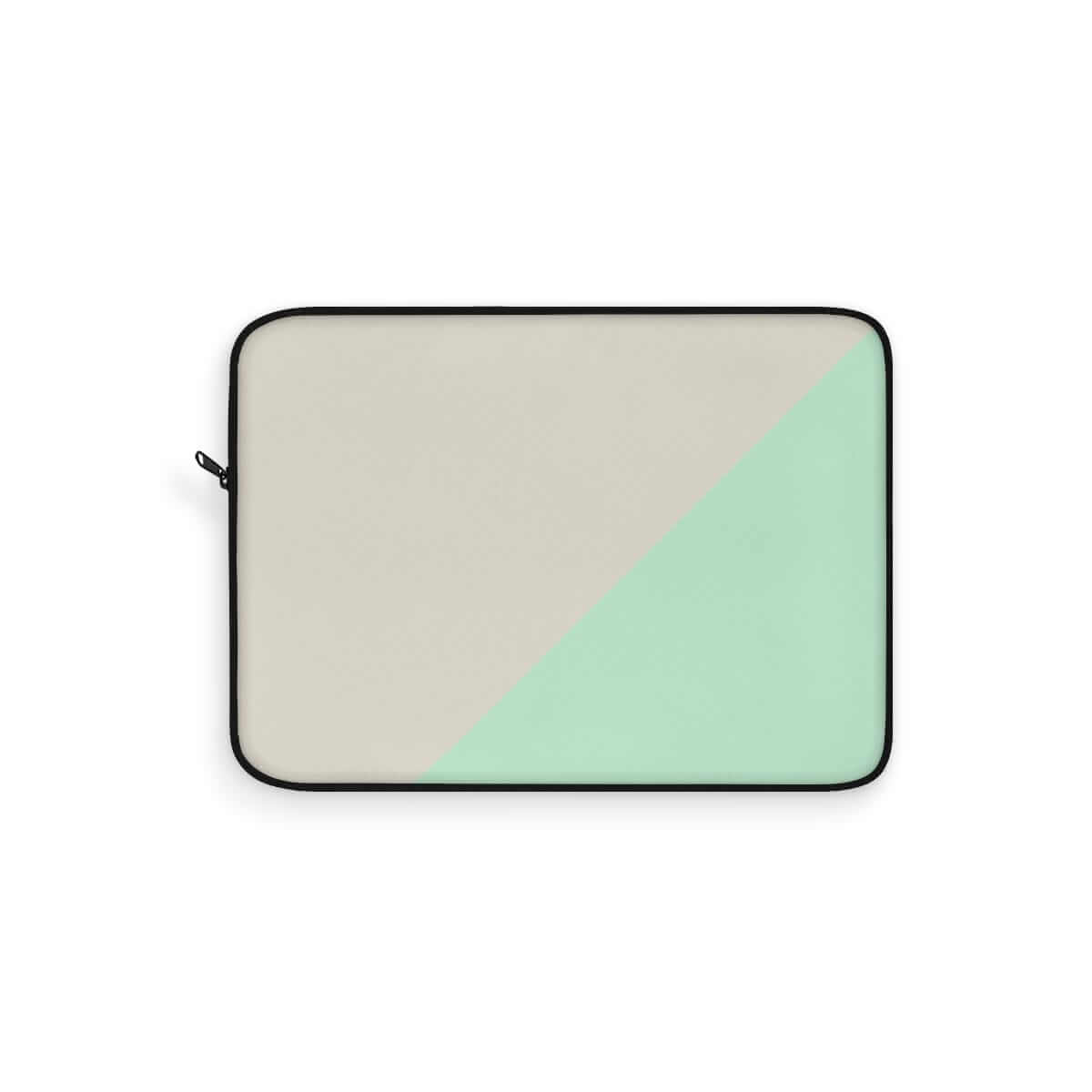 Laptop sleeve in black trim with beige canvas on one side and mint green panel on the other in a minimalist style