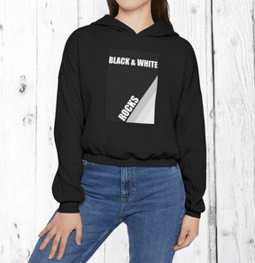 Person wearing black cotton hoodie with white geometric design and "BLACK & WHITE ROCKS" text