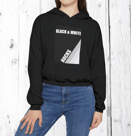 Person wearing black cotton hoodie with white geometric design and "BLACK & WHITE ROCKS" text