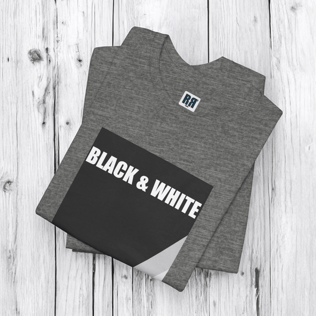 Deep heather gray t-shirt with black and white rock graphic laid flat on white wood texture surface