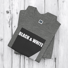 Deep heather gray t-shirt with black and white rock graphic laid flat on white wood texture surface