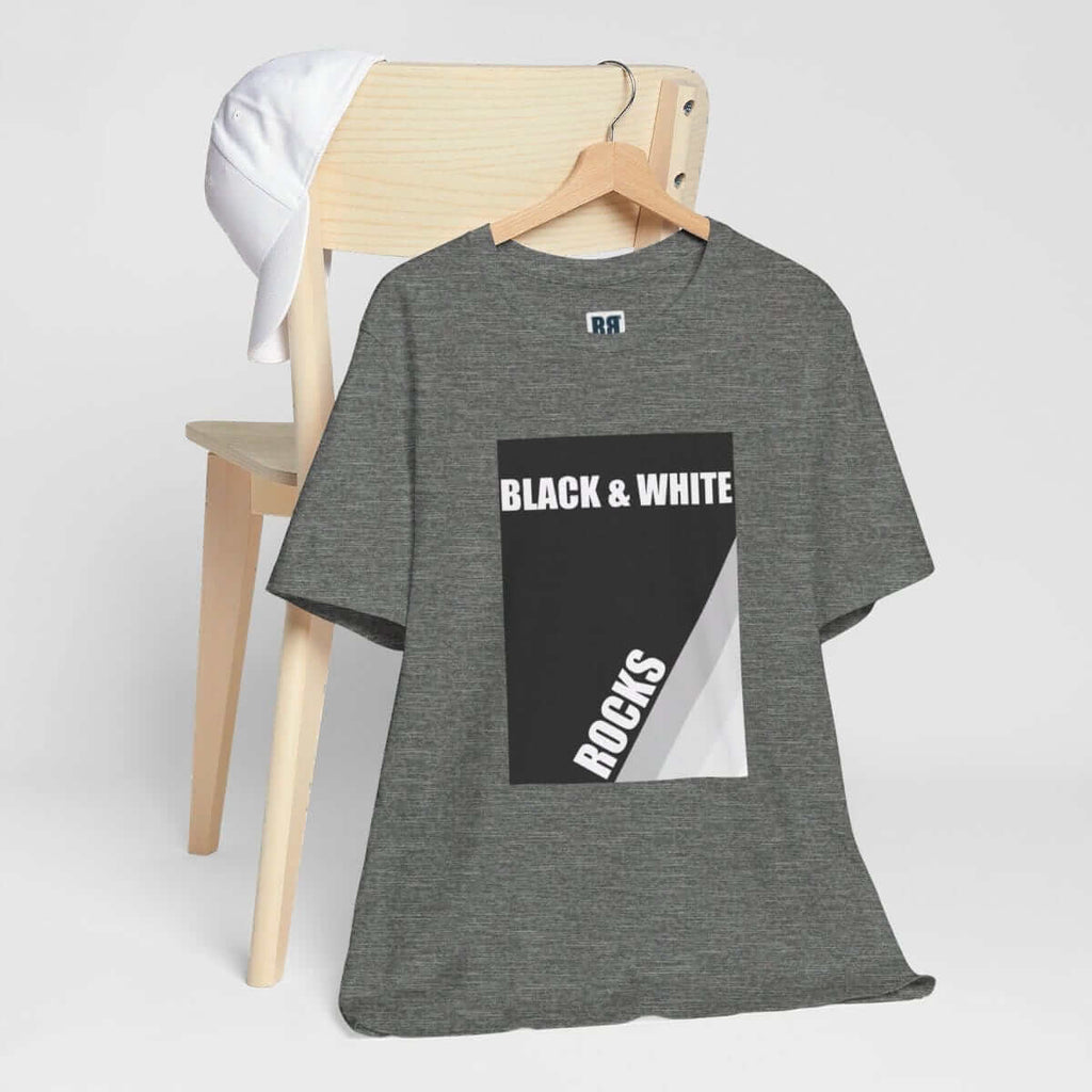 Deep heather gray t-shirt with 'BLACK & WHITE ROCKS' rock print on a wooden chair with a white cap