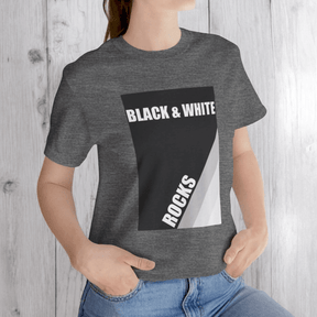 Person in deep heather gray t-shirt with black and white rock print reading 'BLACK & WHITE ROCKS'