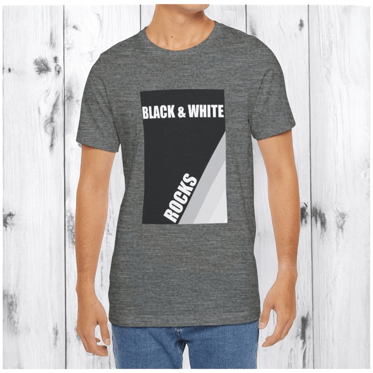 Deep heather cotton t-shirt with black rock print 'BLACK & WHITE ROCKS' against wood-textured paneling