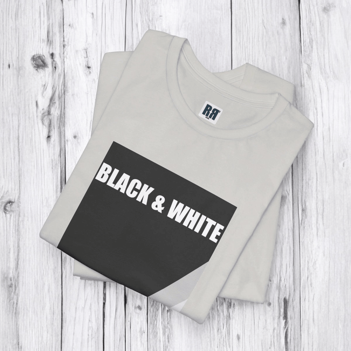 Folded black and white cotton blend sleeve tee featuring abstract rock print and crew neckline with short sleeves