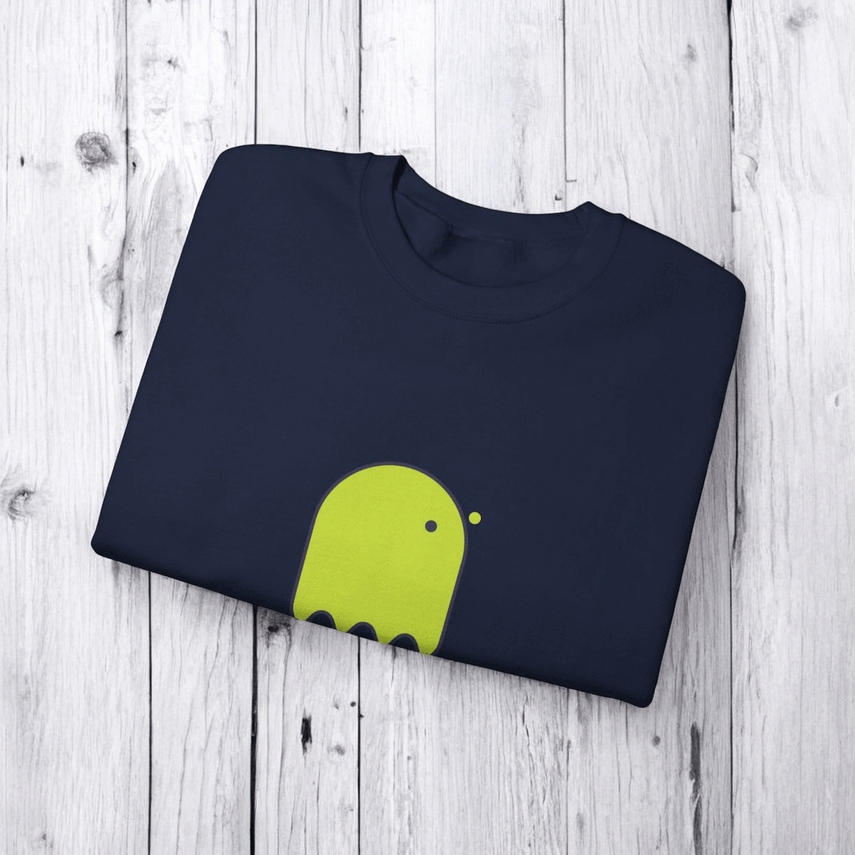 Navy blue cotton T-shirt with short sleeves and bright green abstract graphic printed across the chest