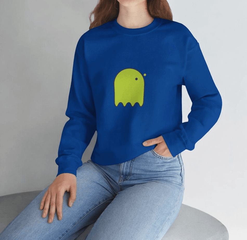 Blue cotton sweatshirt with green cartoon ghost graphic on front, styled casually with blue denim jeans