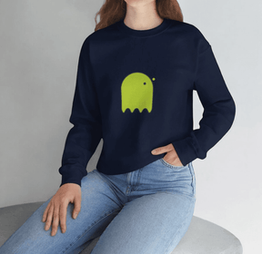 Navy cotton sweatshirt featuring a bright green ghost graphic, paired with light blue denim jeans in a relaxed fit