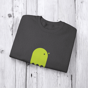 Folded gray cotton t-shirt with lime green abstract graphic, neatly folded on a light wooden surface
