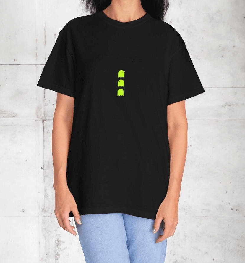 Black cotton t-shirt with neon green abstract shapes, short sleeves, and straight hem styled with light blue jeans