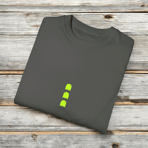 Gray cotton unisex T-shirt with crew neck and neon green ghost graphics folded neatly on a wooden surface