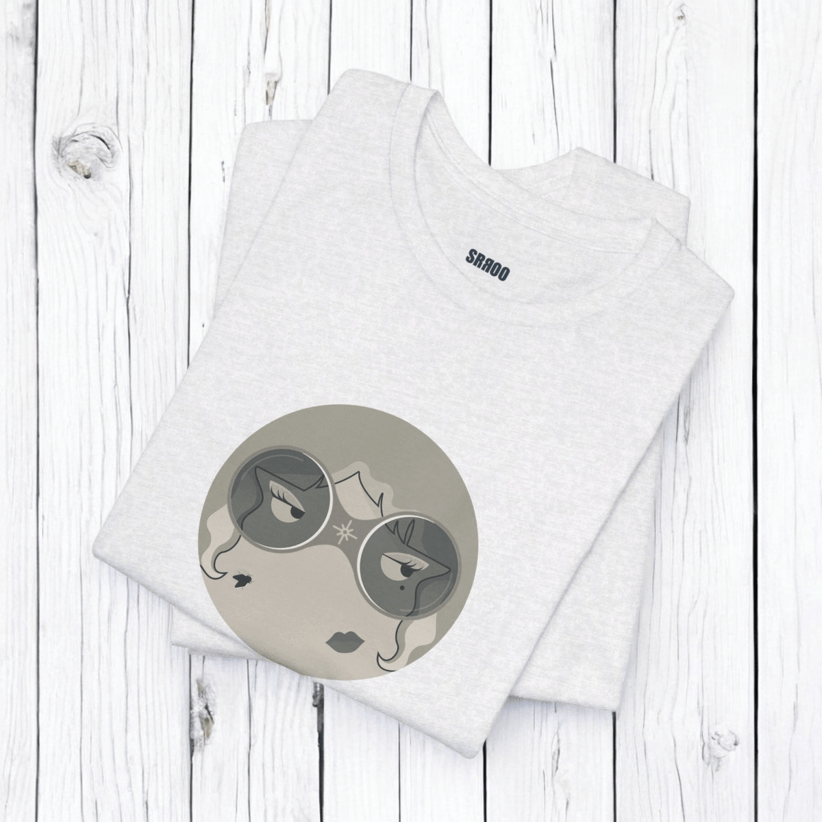 Black and white short sleeve cotton t-shirt folded showing ribbed collar and graphic print on front