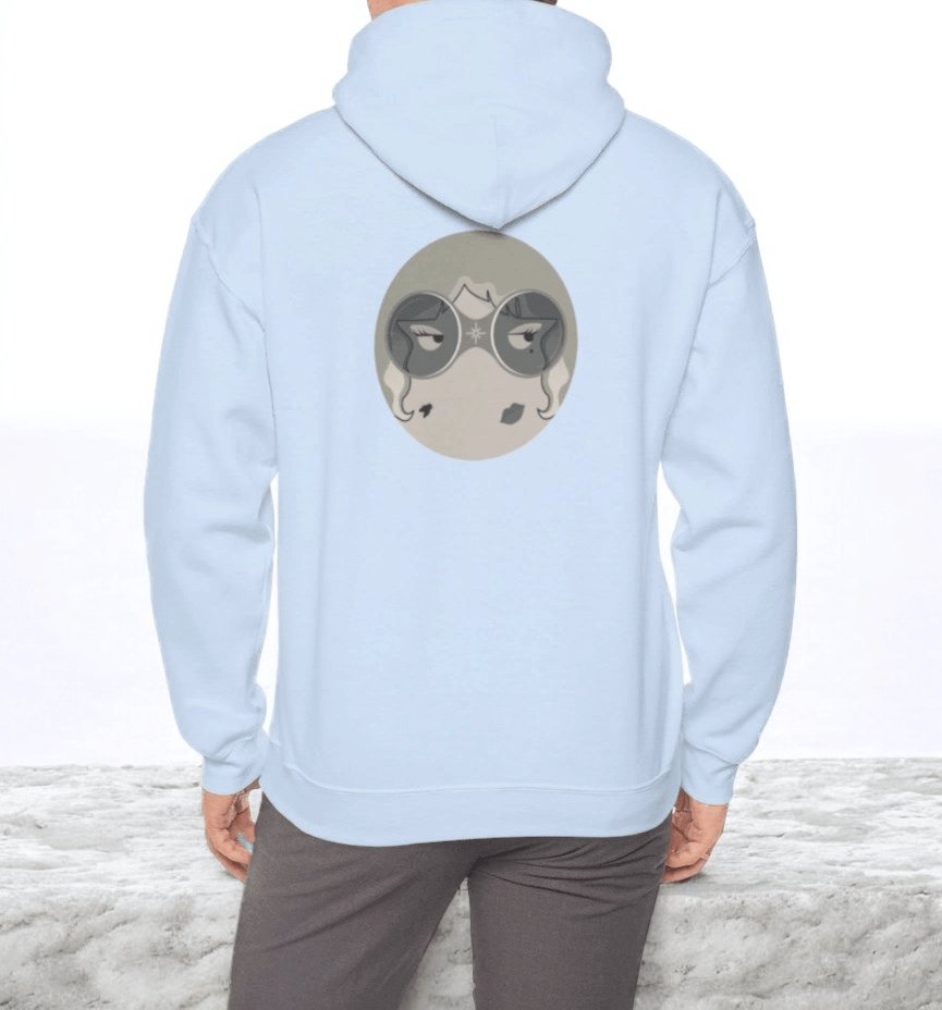Light blue cotton hoodie featuring a large stylized face graphic with masked eyes printed on the back