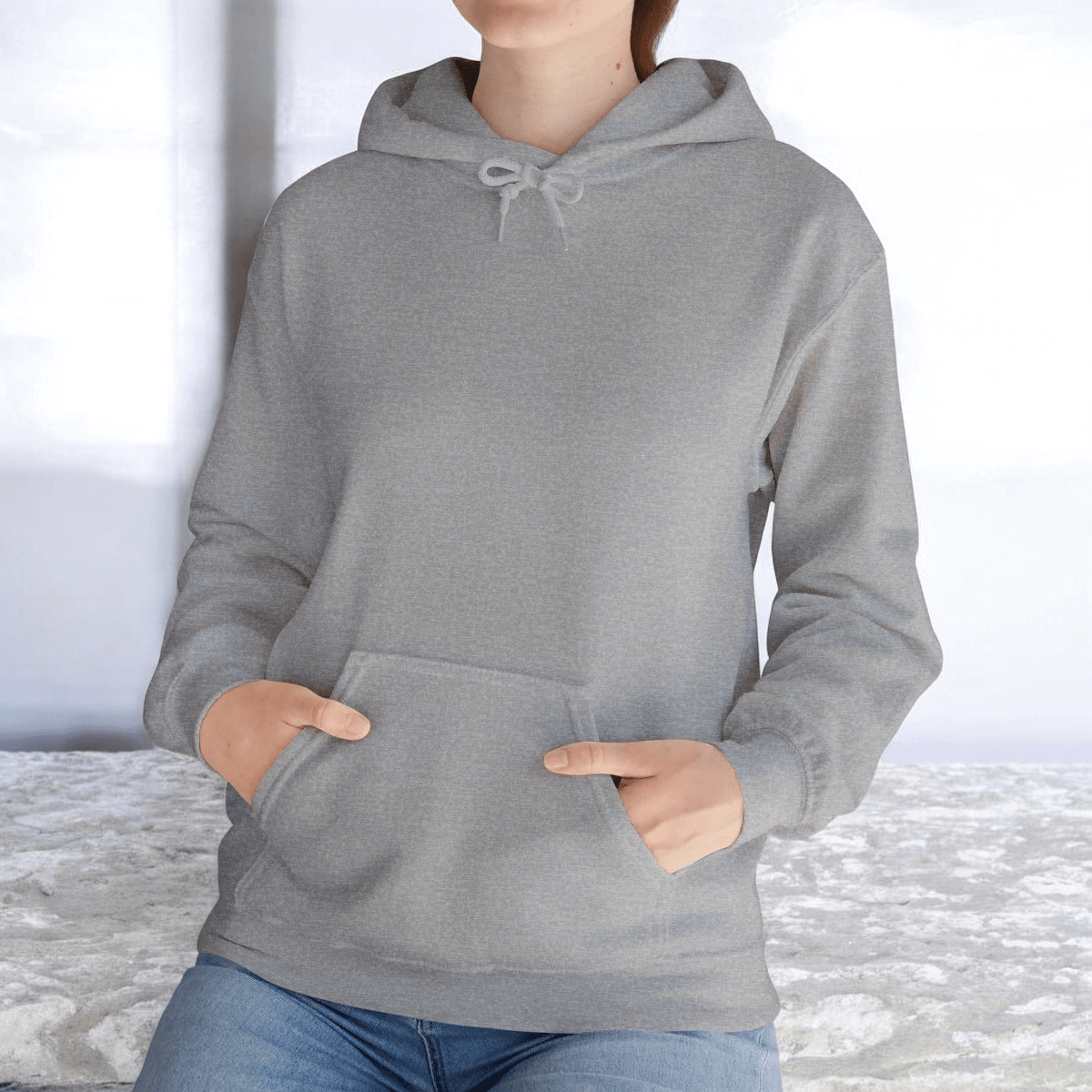 Sport grey cotton hoodie with front pouch pocket, ribbed cuffs and hem, styled in a casual outdoor setting