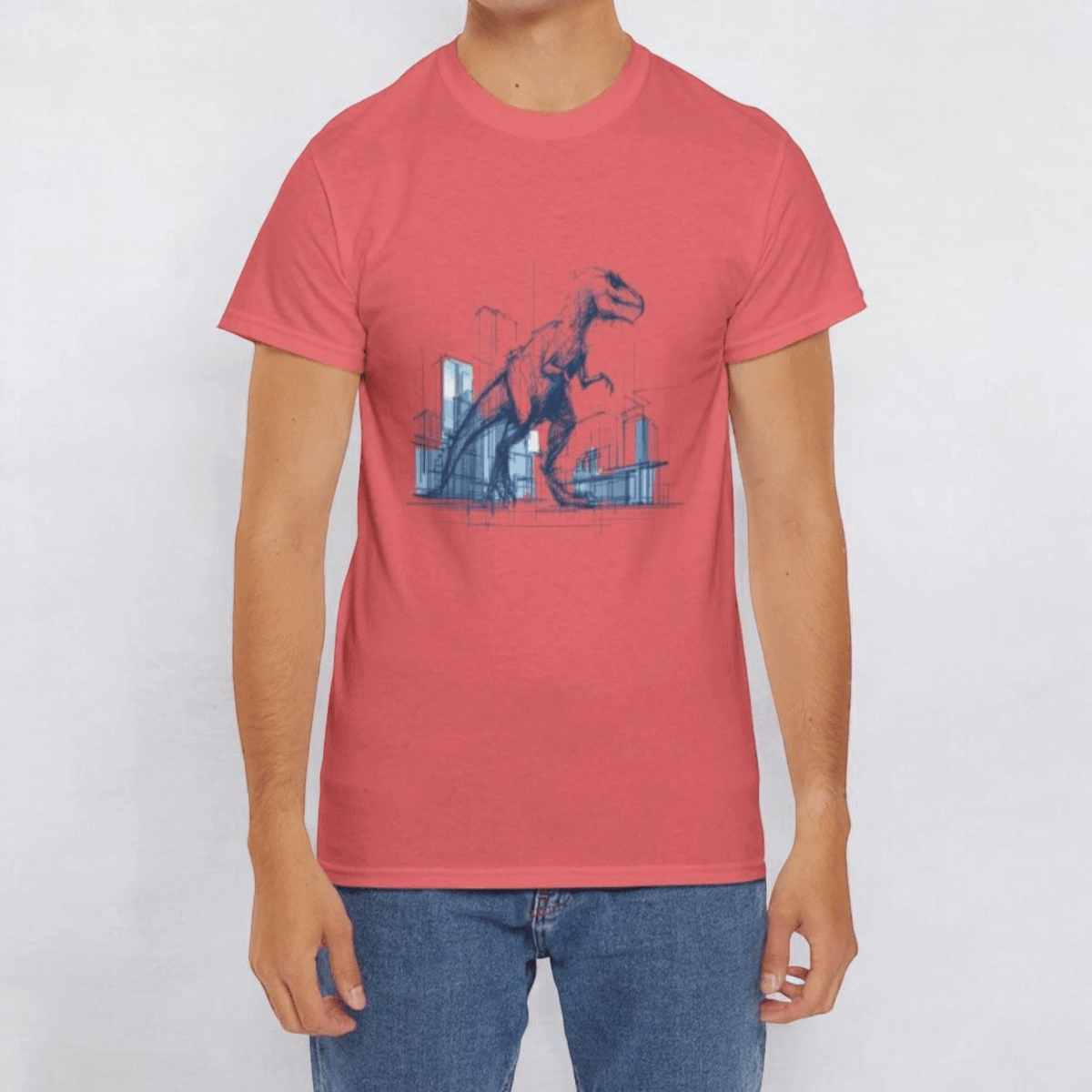 Light pink cotton T-shirt with a blue hand-drawn T. rex and cityscape graphic, styled with medium-wash denim jeans