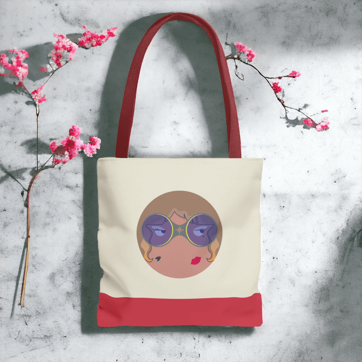 Red canvas tote bag with natural leather handles and bottom trim featuring spacious open top and simple design