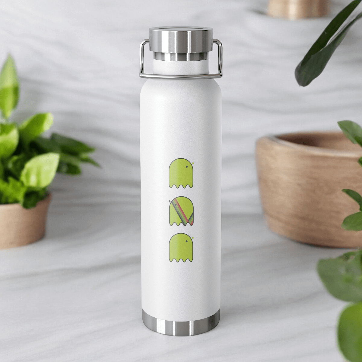 White plastic bottle with green ghost icons, set on a marble surface with surrounding green plant accents