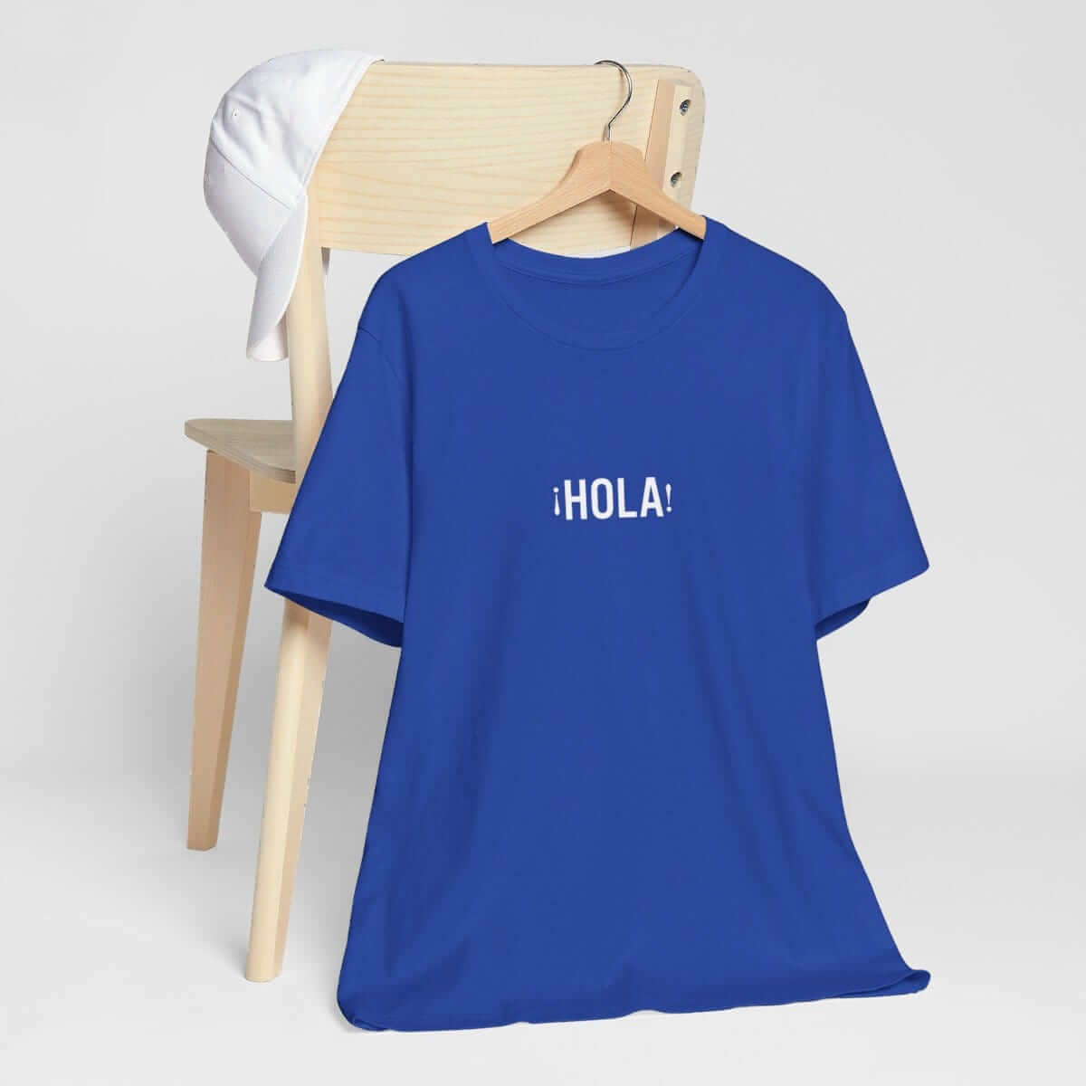Classic blue cotton short-sleeve t-shirt featuring white Hello Hola text printed across the chest in a casual style