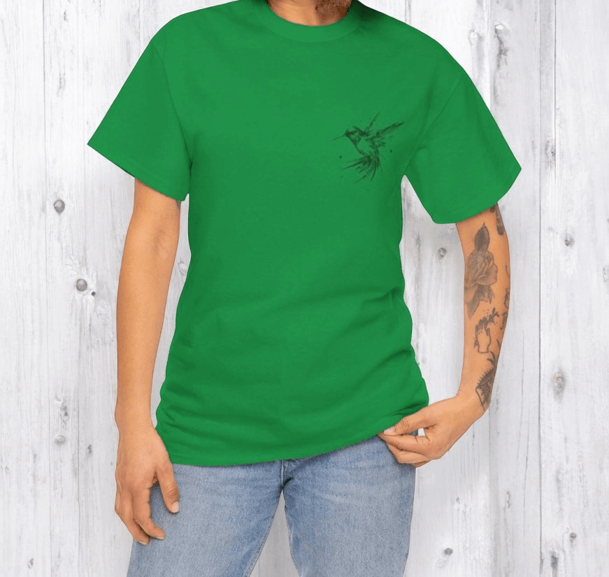 Green cotton T-shirt featuring a small black hummingbird graphic on the chest, paired with light wash denim jeans