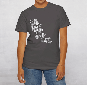 Dark gray cotton T-shirt featuring a white floral print design on the front, styled casually with blue jeans