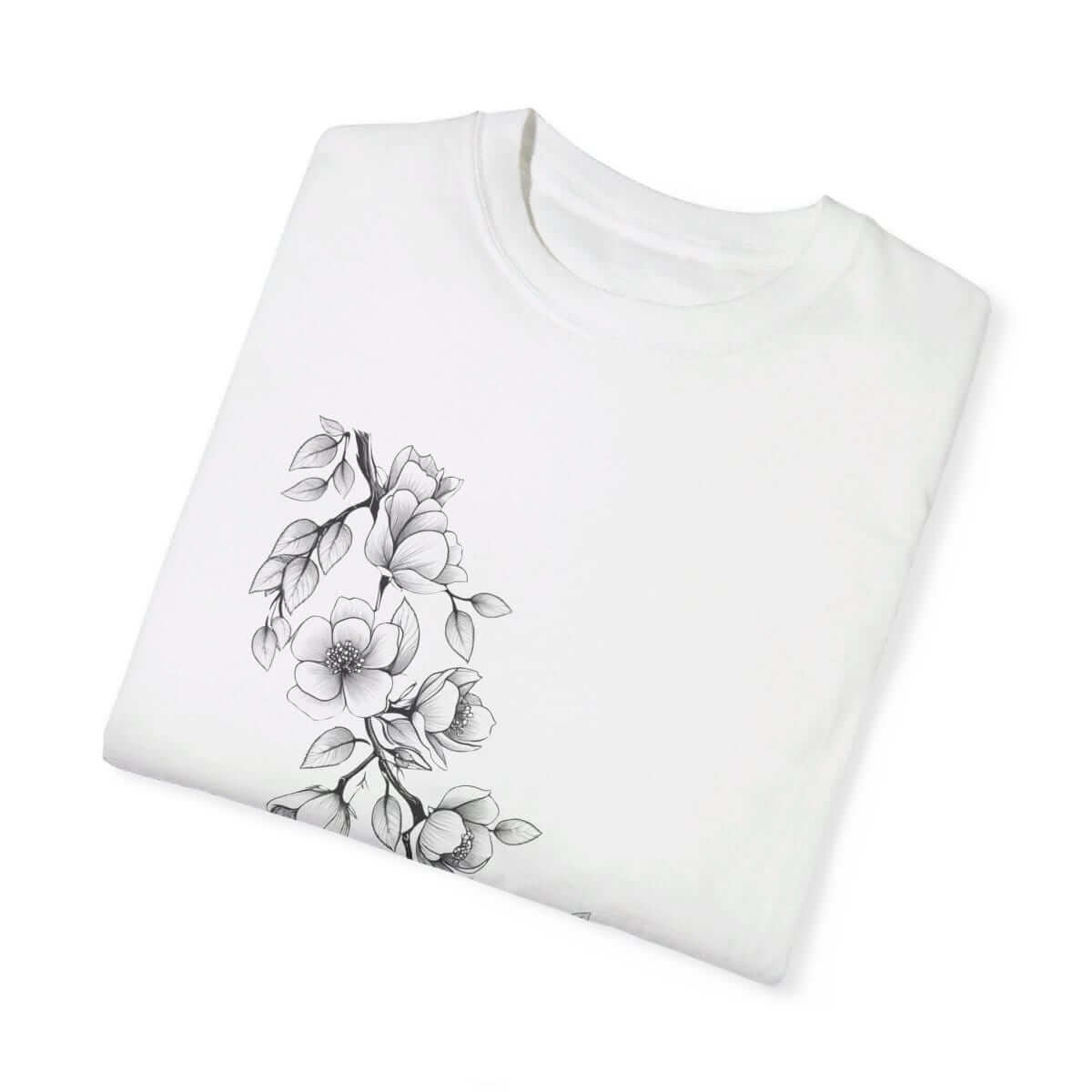 White cotton T-shirt with black floral print design, neatly folded with a crew neckline and short sleeves