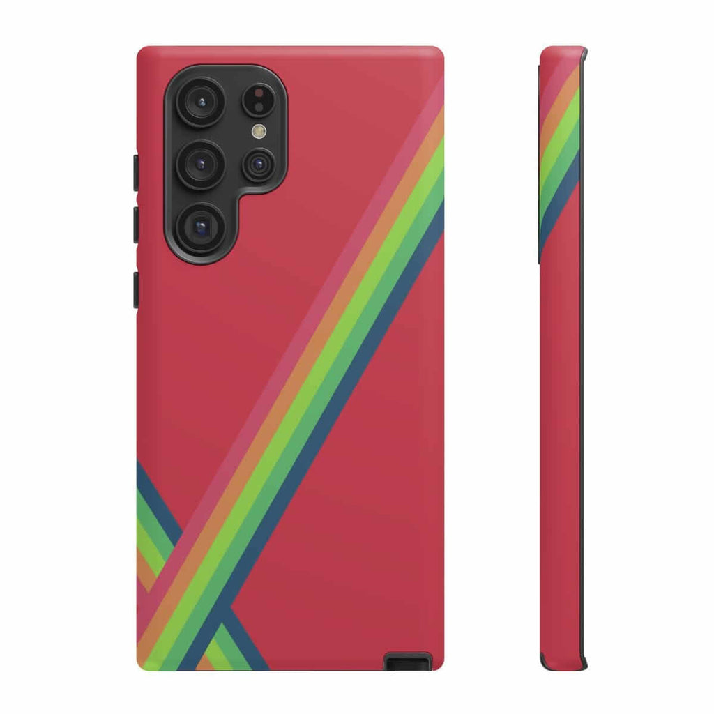 Red phone case with diagonal rainbow stripes, hard plastic shell, and precise cutouts for multi-lens rear camera