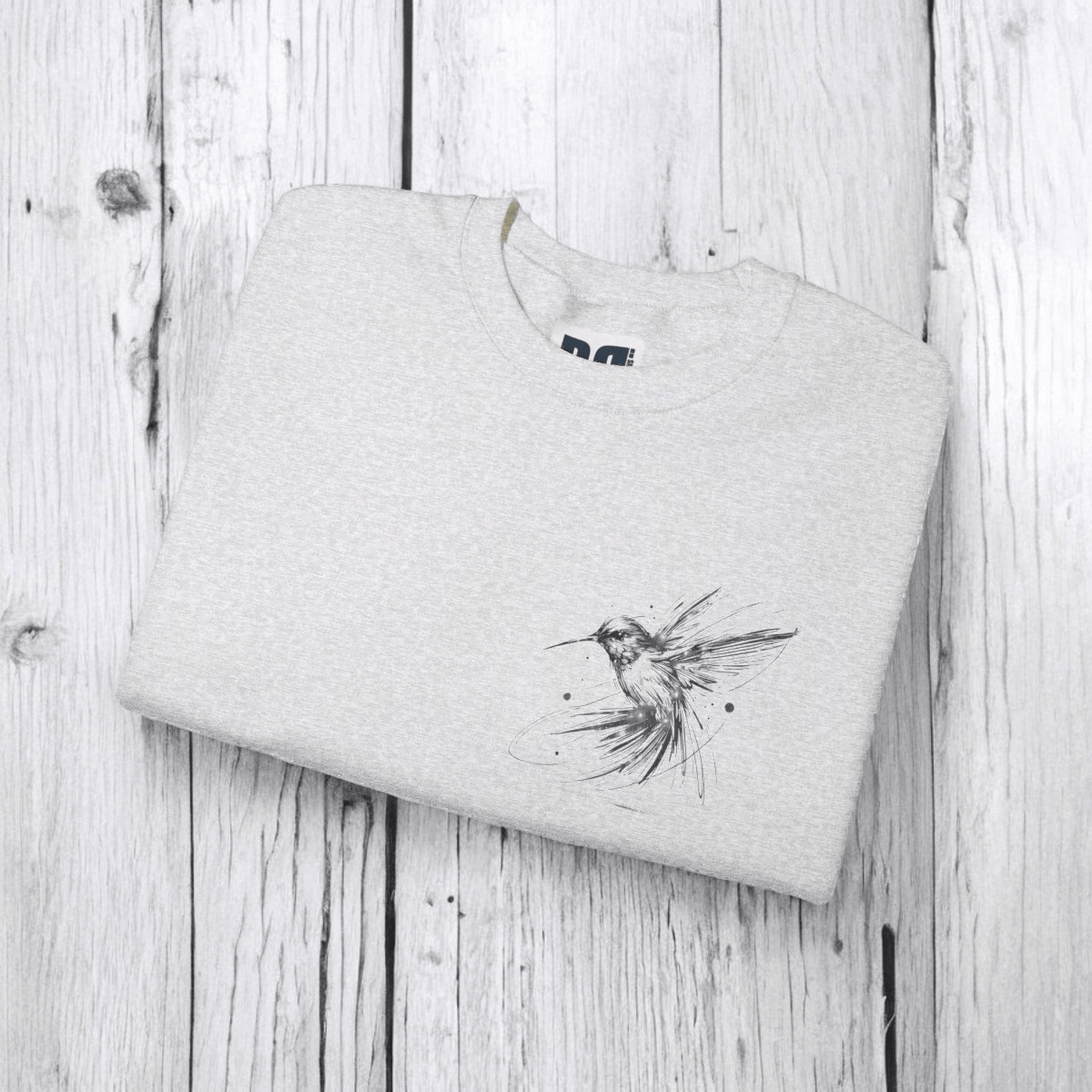 Ash gray sweatshirt made from soft cotton blend fabric folded to show ribbed cuffs and hem detailing