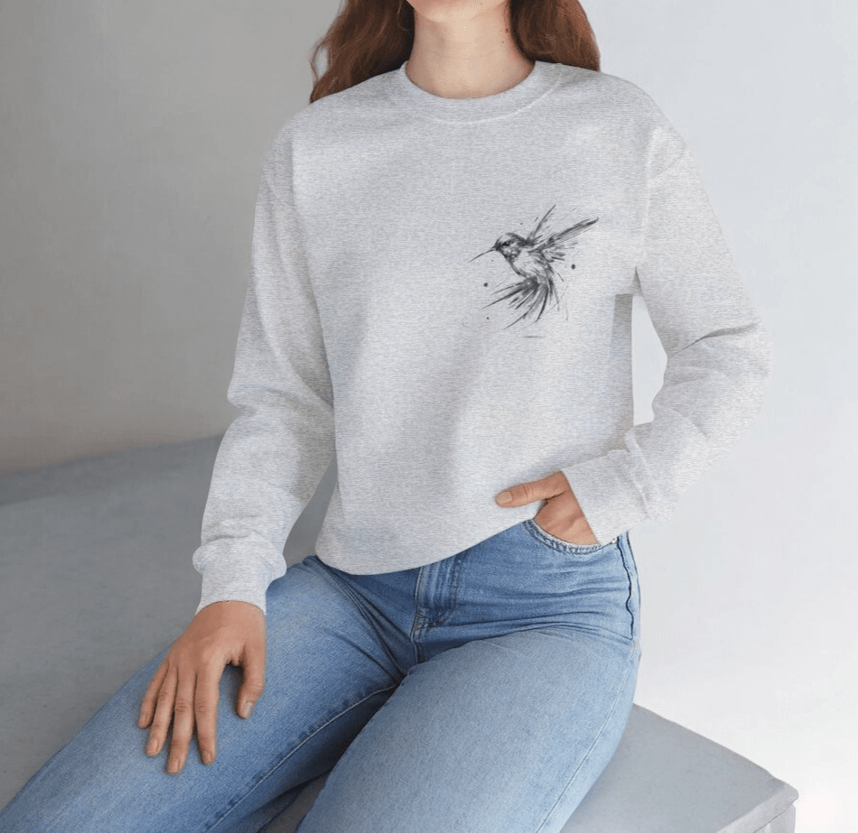 Light gray cotton sweatshirt with long sleeves and subtle wing graphic on the chest in a casual fit
