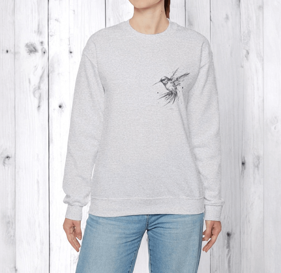 Ash gray sweatshirt made of soft fabric featuring long raglan sleeves with mesh panels and a relaxed fit