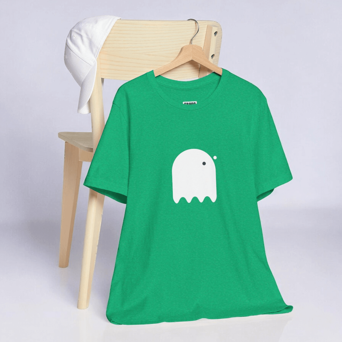 Heather Kelly gray short sleeve cotton t-shirt with white button-eyed ghost graphic centered on front