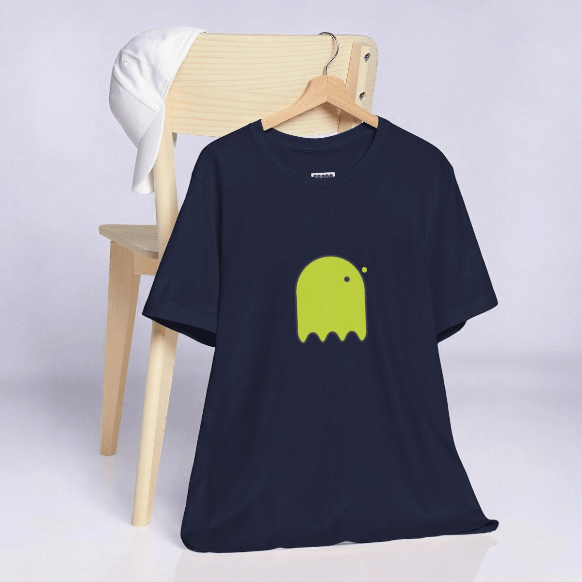 Navy cotton t-shirt with yellow button-eyed ghost graphic on front featuring short sleeves and classic crew neck style