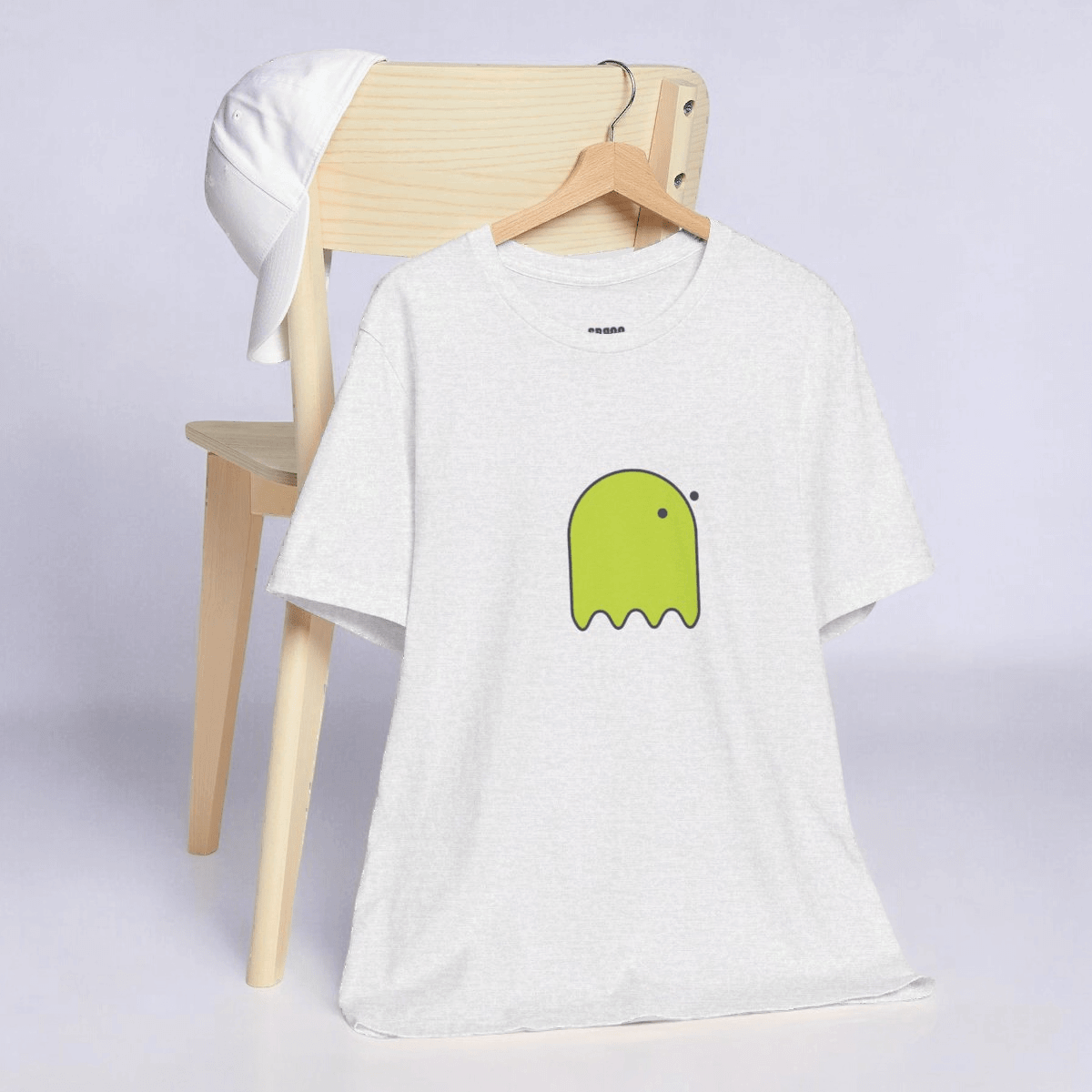 Yellow cotton t-shirt with a front graphic of a ghost with button eyes styled on an ash gray background fabric
