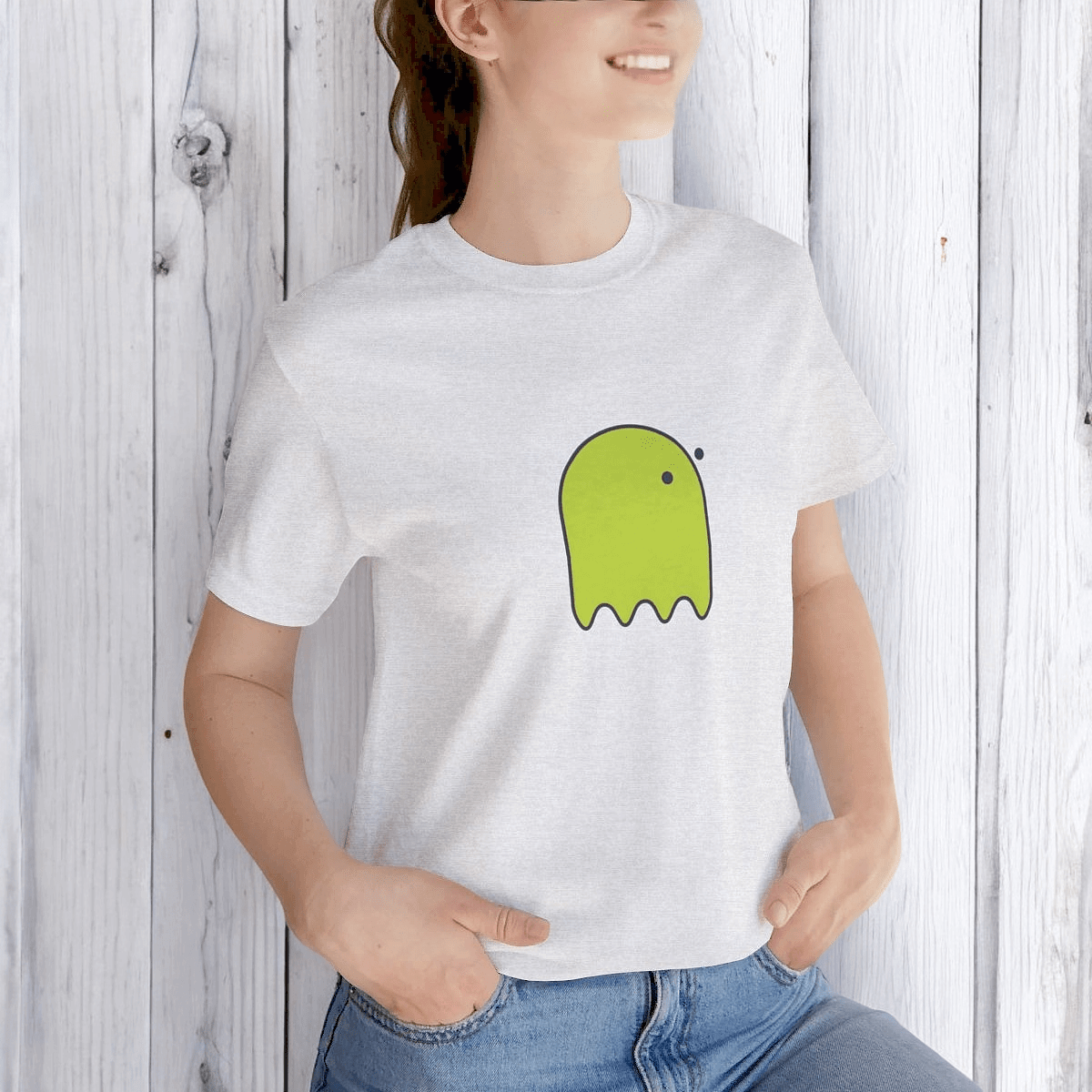Cotton ash gray t-shirt with yellow button eye ghost graphic printed on front in casual short sleeve style